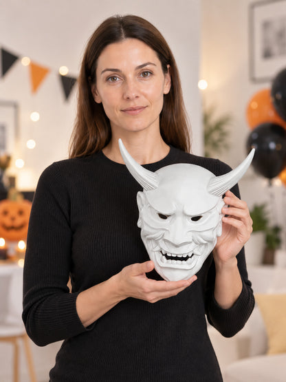 White demonic mask with horns and fangs