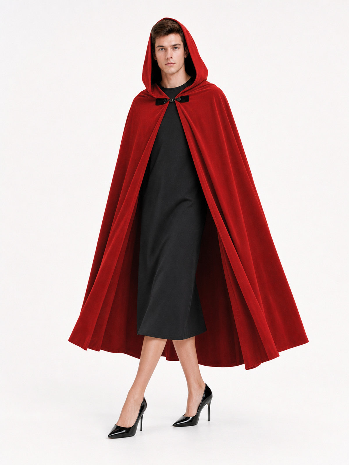 Red hooded cape with a black front toggle and long flowing panels, shown full-body on a model
