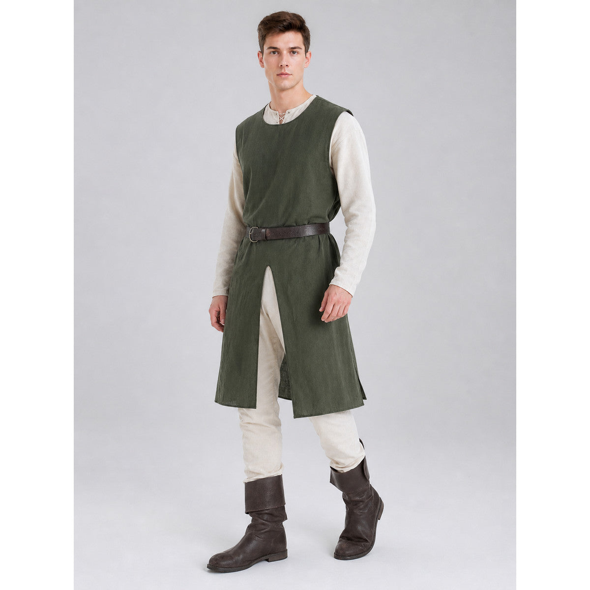 Three-quarter view of a green sleeveless tunic with a brown belt, white shirt, trousers, and tall brown boots