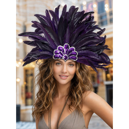 Large purple and black feather headpiece with a sequined crest, shown in close-up on a smiling model