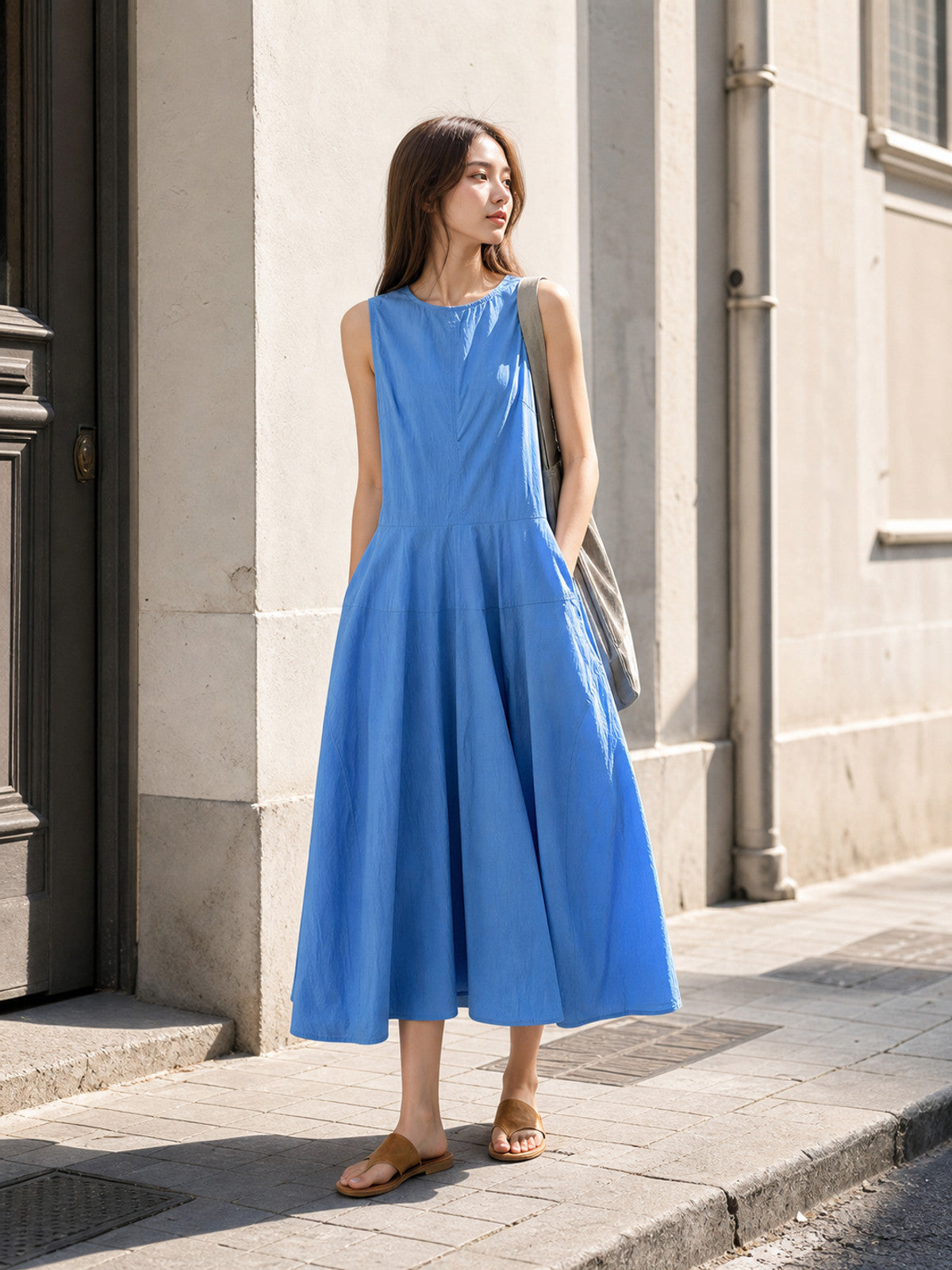 Women's blue sleeveless midi dress with pockets
