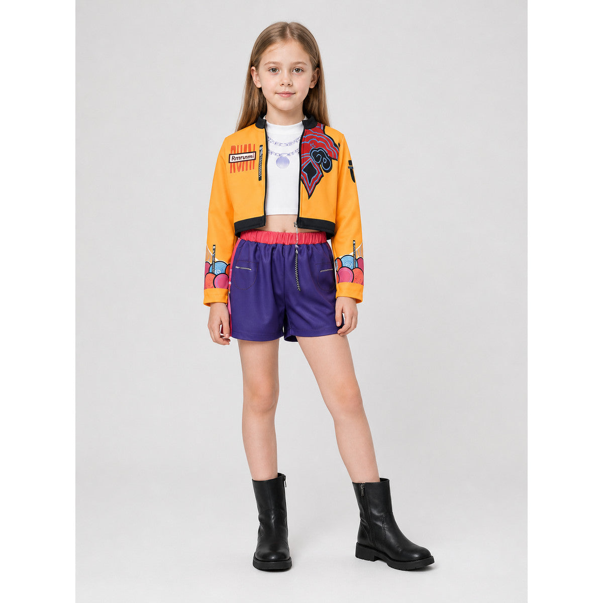 Children's set with an orange jacket and purple shorts lifestyle view