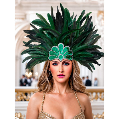 Feather carnival headpiece with green and black plumes and a beaded green centerpiece, shown on a model in an ornate interior