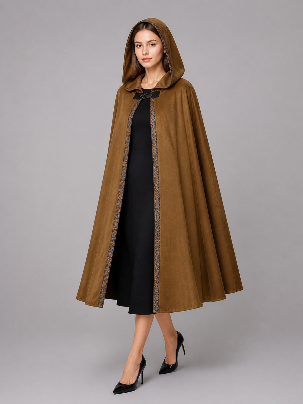 Brown hooded costume cape shown on a model in a full-body front view, with patterned front trim and black tie
