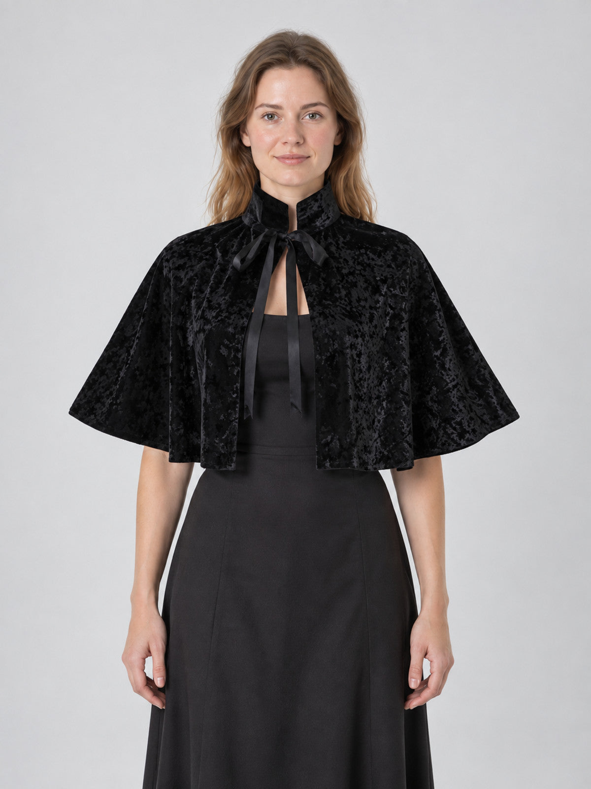 Black velvet cape with high collar and ties
