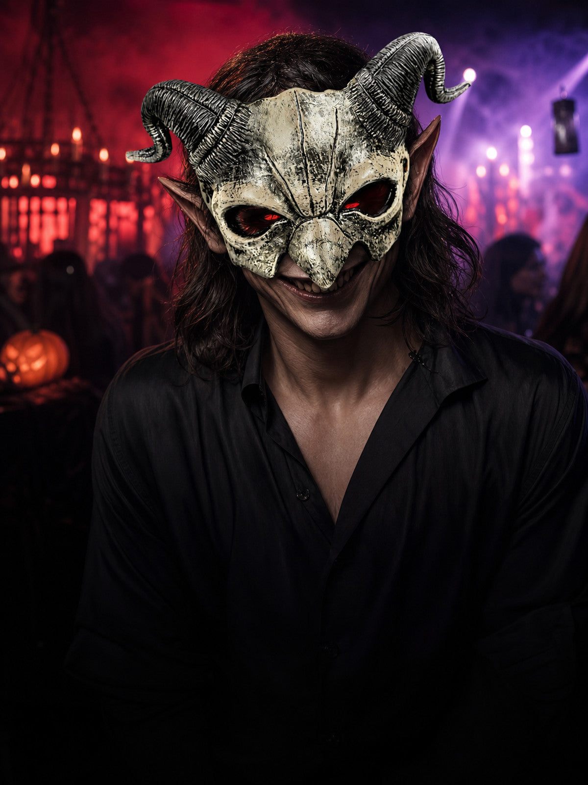 Distressed off-white demon half mask with black ridged horns, pointed ears, and red eye openings on a model in black clothing