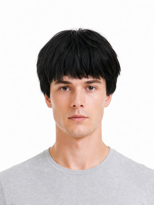 Black short costume wig with straight bangs shown from the front on a model, with smooth, layered fibers