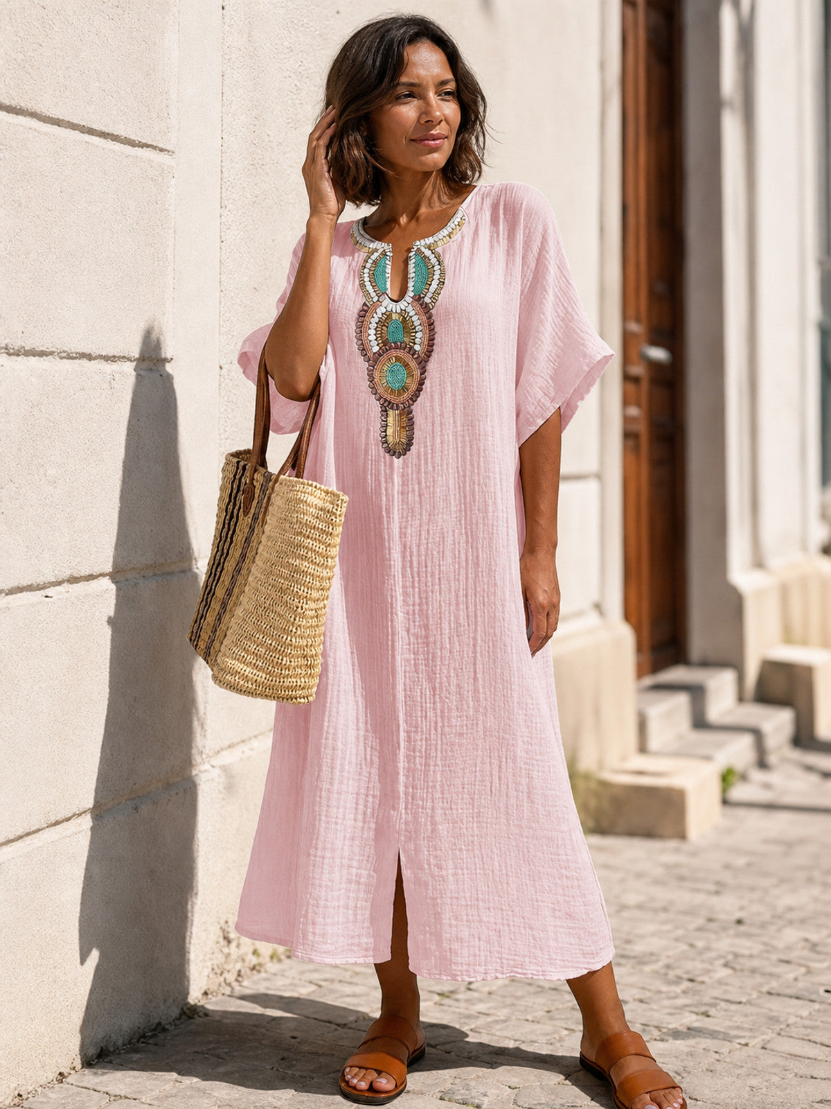 Pink loose-fit midi dress with embroidery and a slit main product view