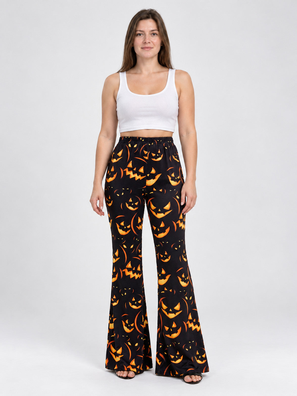Black Flared Carnival Pants with Orange Smiling Pumpkin Print