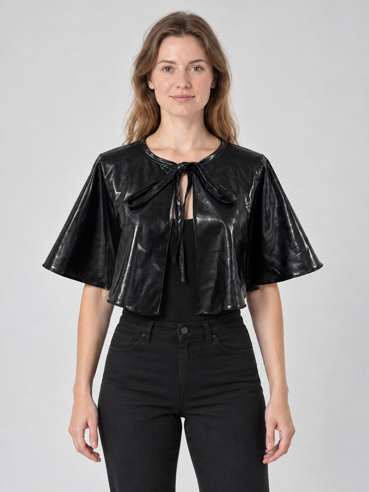Short black shiny cape with ties