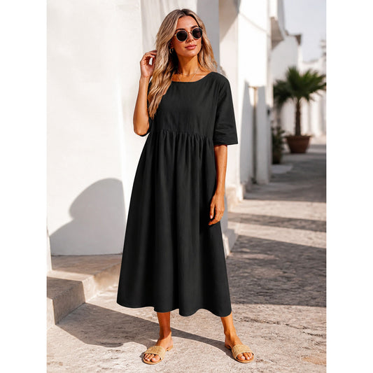This black long dress features a round neckline, elbow-length sleeves, and a relaxed A-line silhouette. The solid-color design gives it a clean look and makes it easy to pair with different everyday wardrobe pieces. The top has a round neck