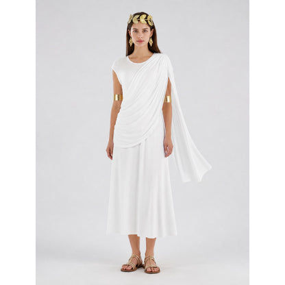 Full-body model wearing a white draped dress with a long shoulder train, gold arm bands, leaf headband and flat sandals