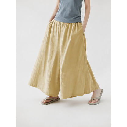 Beige palazzo pants with a loose fit and pockets