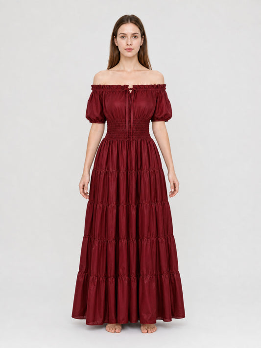 Full-body front view of a wine red dress with an off-the-shoulder neckline, puff sleeves, fitted waist, and tiered maxi skirt