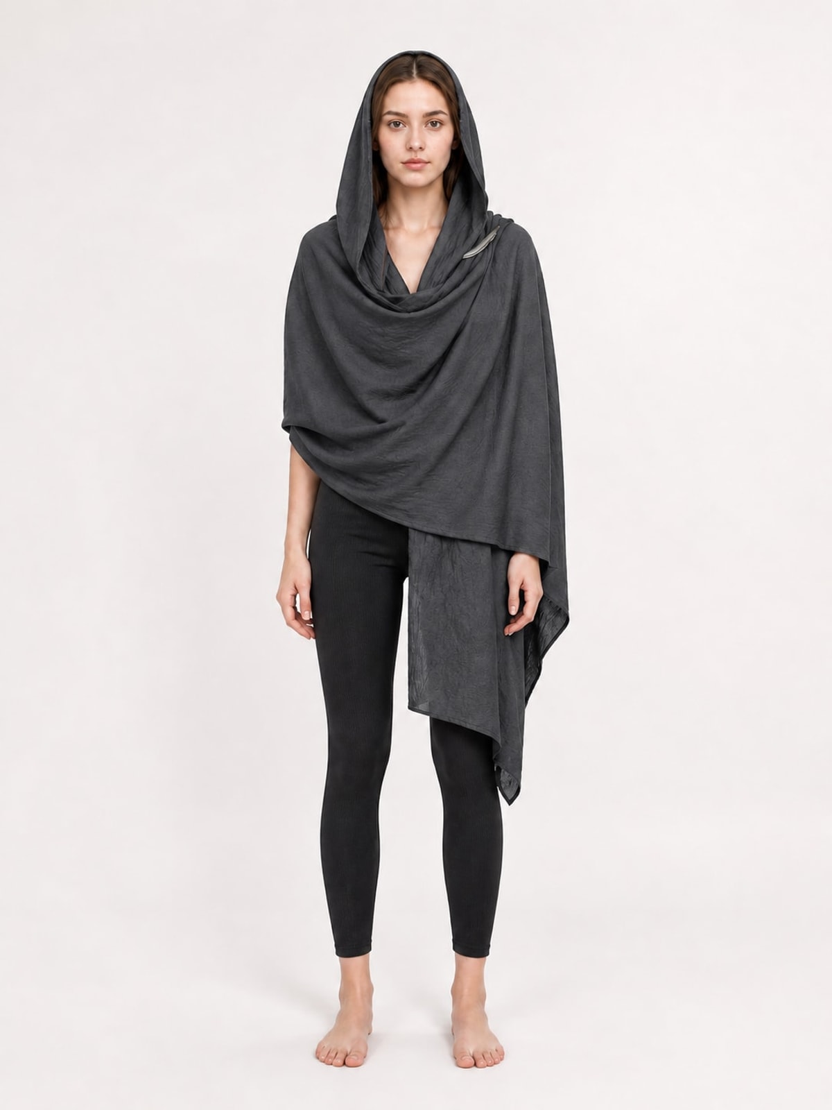 Model wearing the charcoal gray hooded scarf wrap with hood up and long draped front, front view