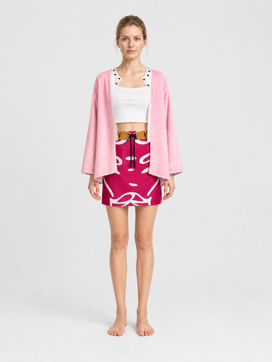 Model wearing the women's Doflamingo cosplay costume: pink open-front jacket, white crop top, hot-pink swirl-print mini skirt and brown belt, front view