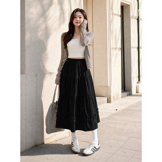 Long black A-line skirt with tiered pleats