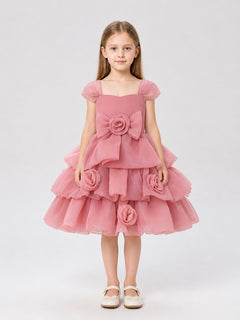 Full-skirt dress with roses for a flower girl at a wedding