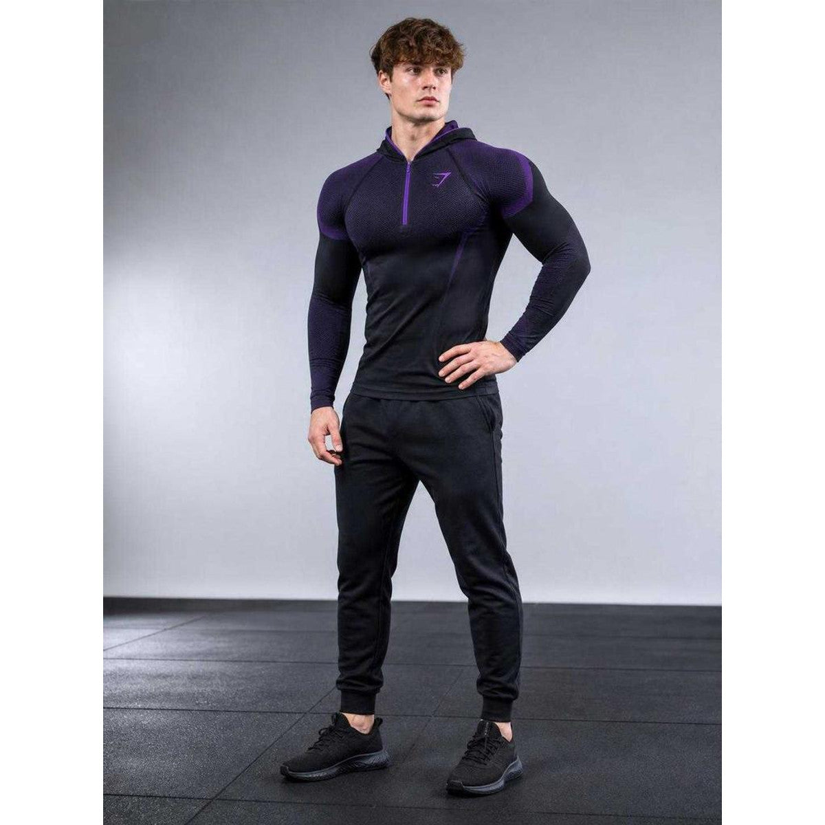 Black athletic hoodie with zipper for fitness on-model view