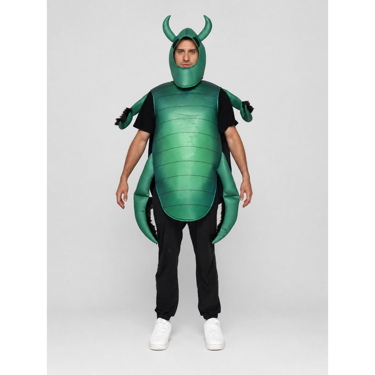 The beetle costume features a full-body insect silhouette with a large segmented green panel on the abdomen. The look is completed by a curved headpiece resembling horns, along with green side and hand elements that imitate insect limbs. Th