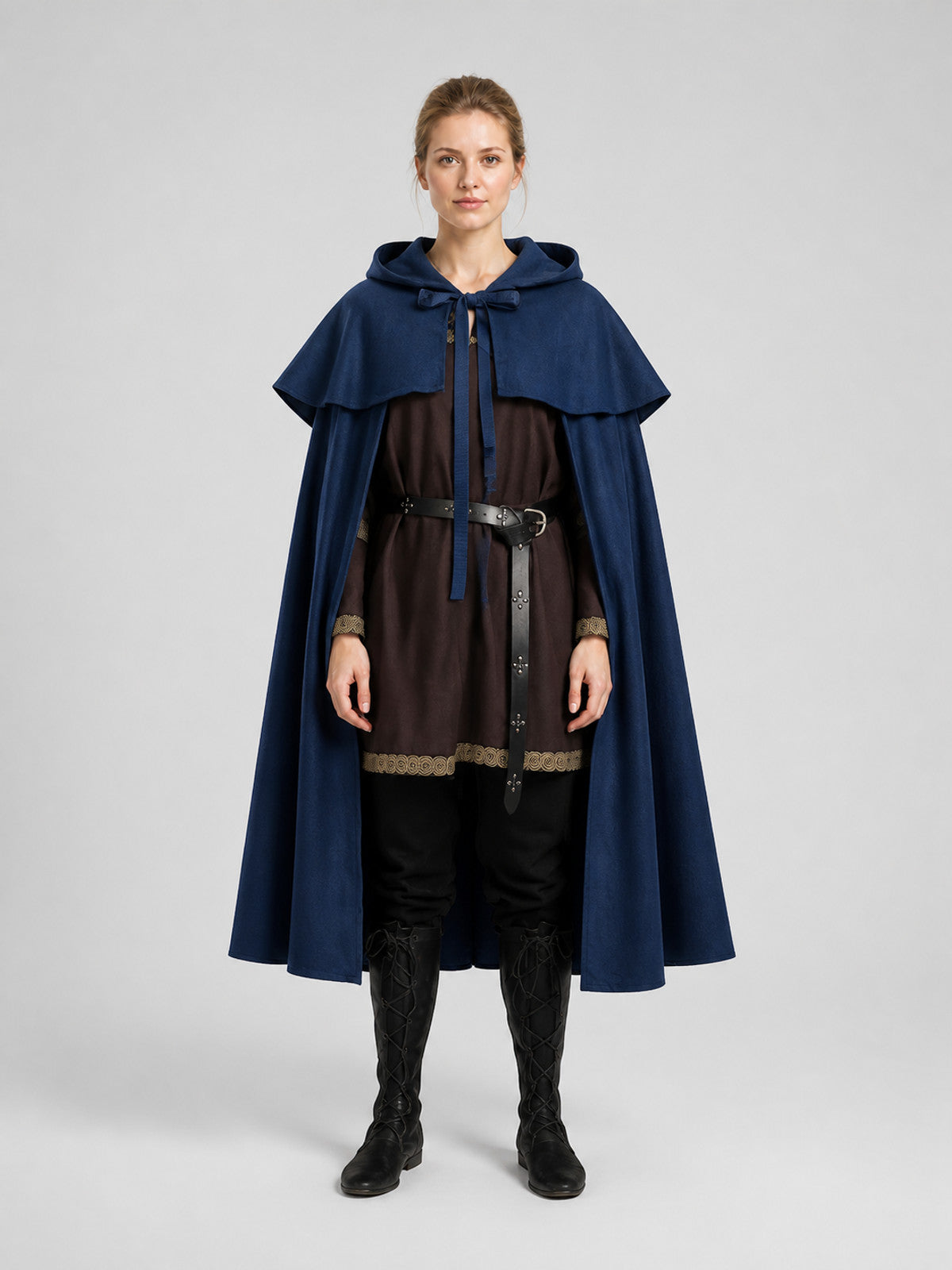 Navy blue hooded cape with layered shoulder capelet, shown full-body on a model over a dark costume outfit
