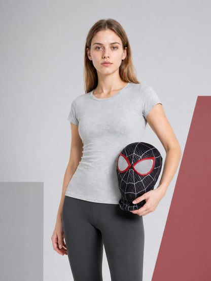 Black carnival mask with a red-and-white pattern