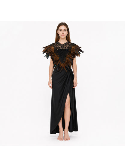 Black lace feather cape with brown and black layered feathers, shown on a full-body model over a long black dress