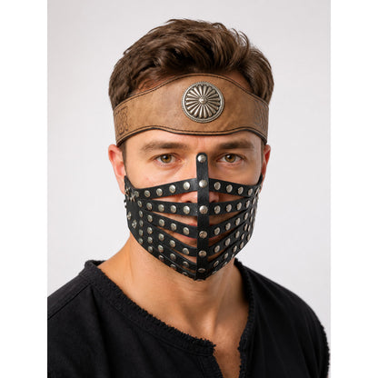 Brown leather-look costume headband and black studded face mask on a male model, shown in a close-up against a plain background