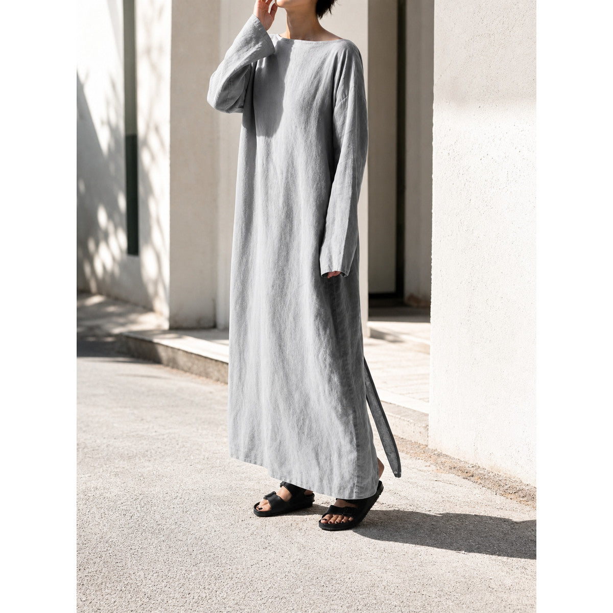 Gray long dress with long sleeves and a slit