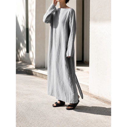 Gray long dress with long sleeves and a slit