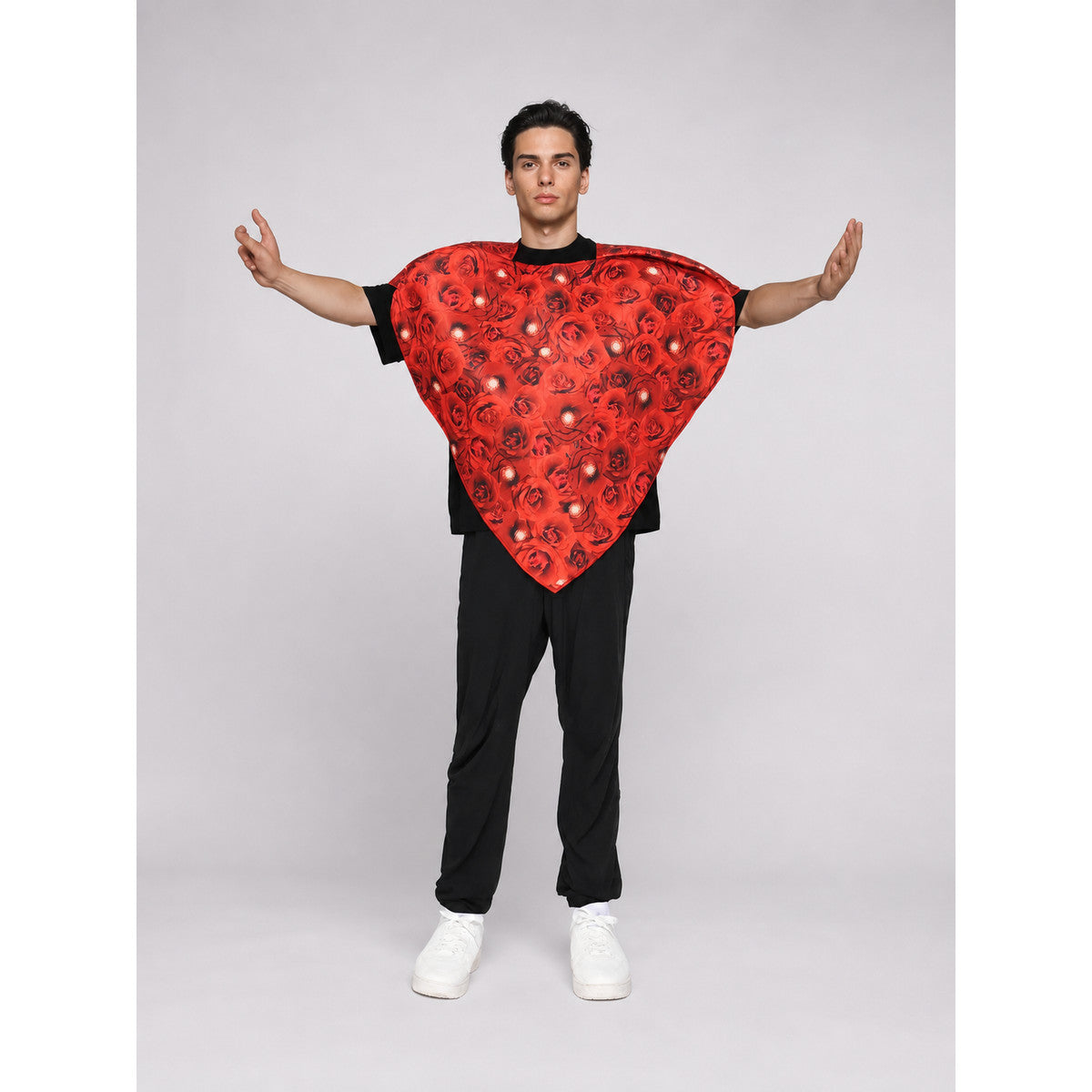 Bright heart-shaped costume with a floral print. A voluminous silhouette with a pointed lower edge and wide short sleeves that extend from the sides of the garment. The surface is decorated with an allover floral pattern reminiscent of rose
