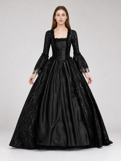 Black dress designed in the aesthetic of a Victorian-era Gothic costume. The front view