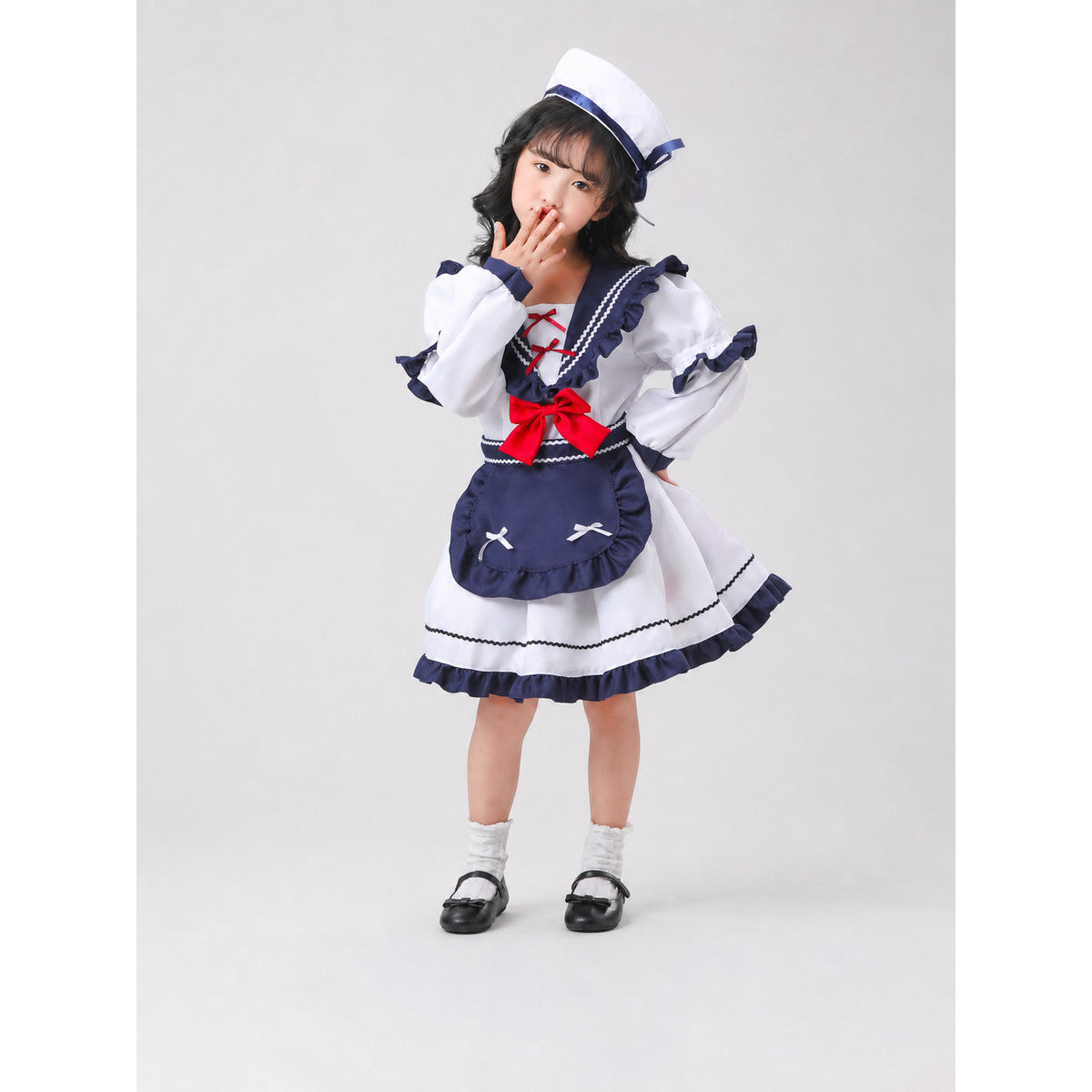 Nautical-style stage costume with bows