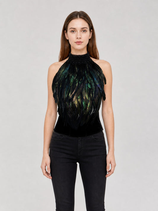 Black halter top with iridescent green and blue feathers and a beaded high collar, shown front-facing on a model