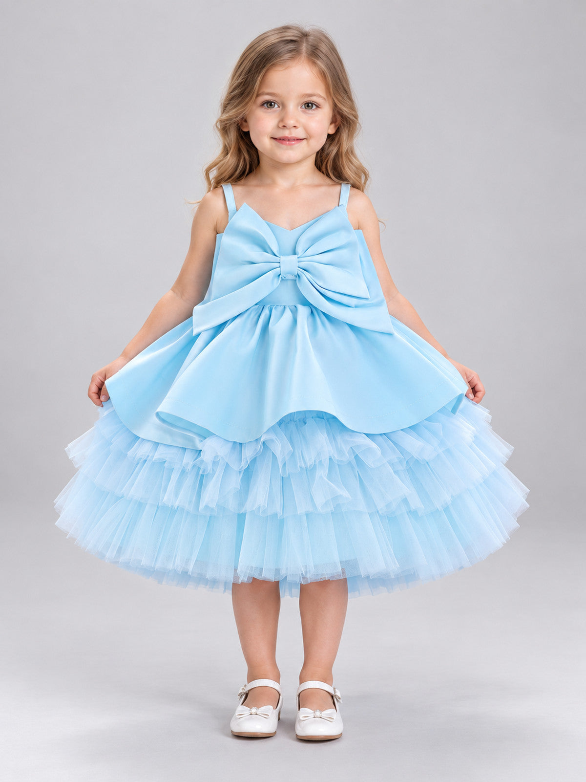 Blue children's holiday dress with a bow and a puffy skirt