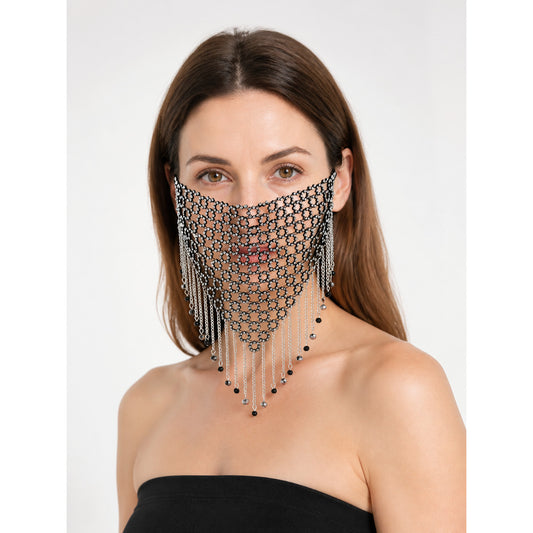 Black and silver chain mesh masquerade mask modeled in a front-facing portrait, with a pointed lower edge and dangling chains