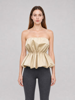 Beige strapless bustier top with peplum