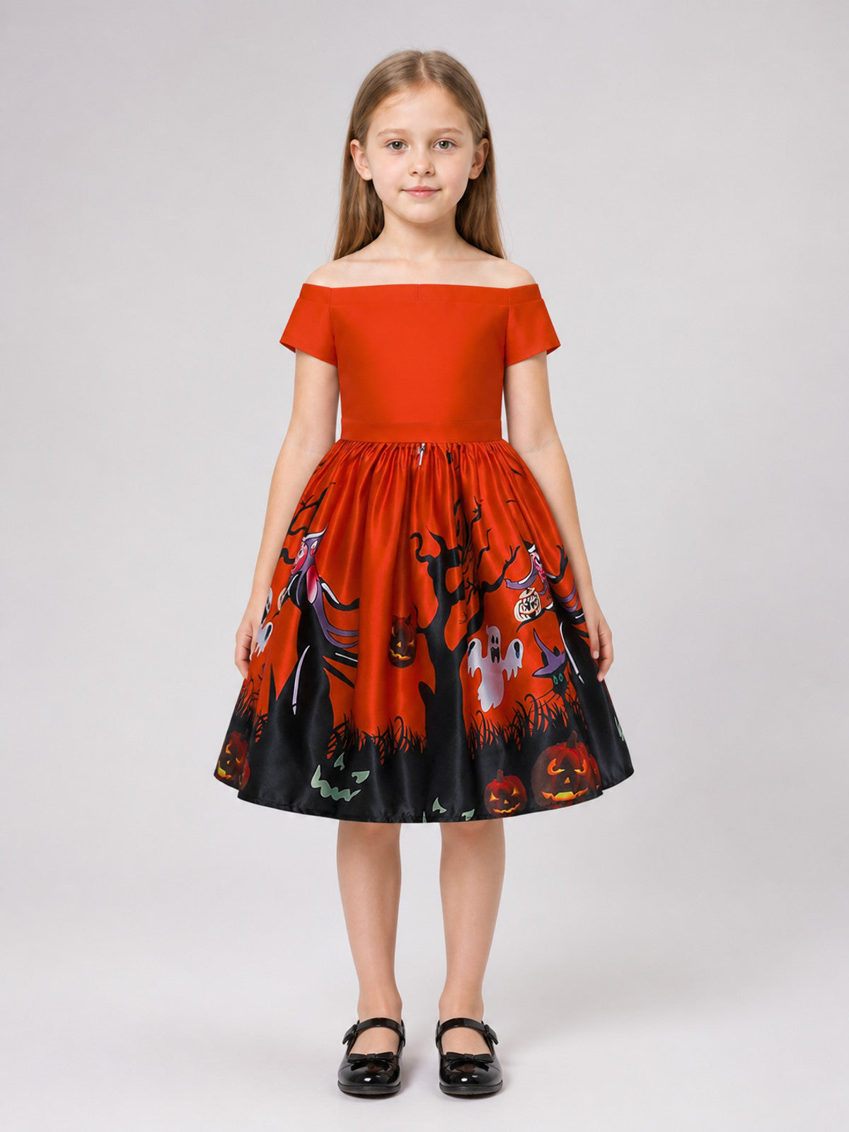 Orange children's dress with a Halloween print on-model view
