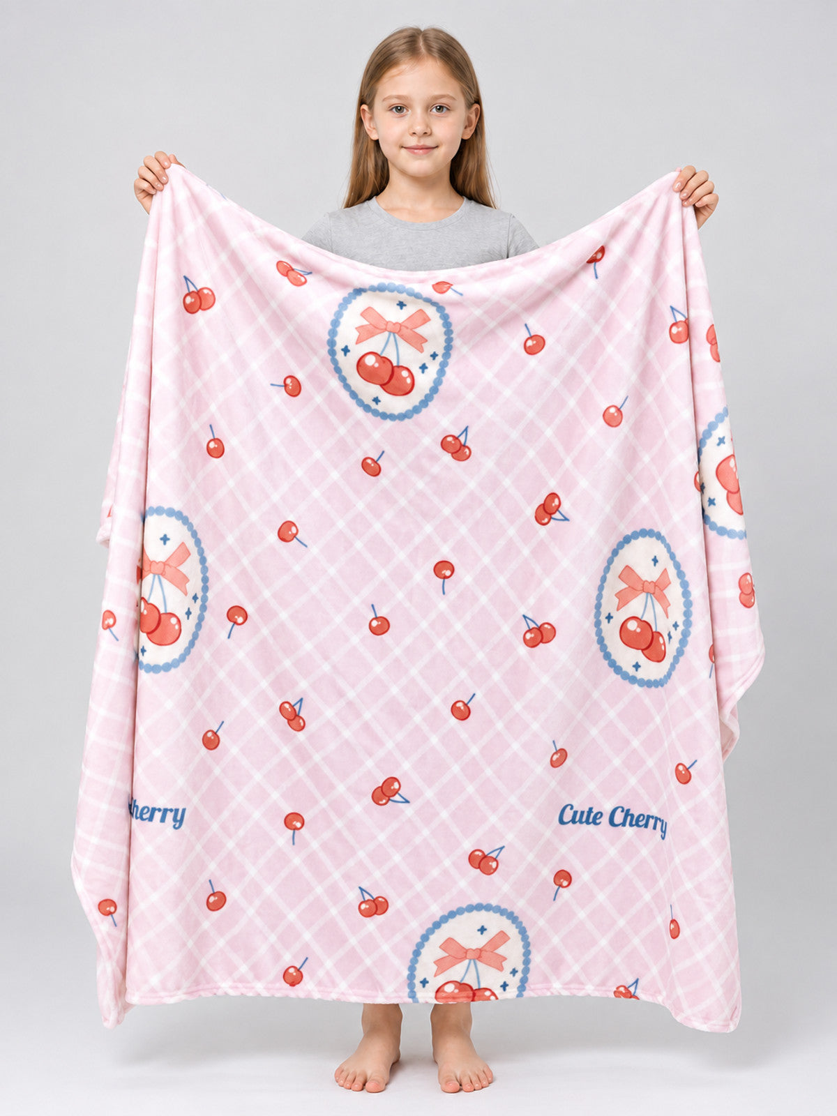 Pink reversible blanket with cherry and bow print, polyester