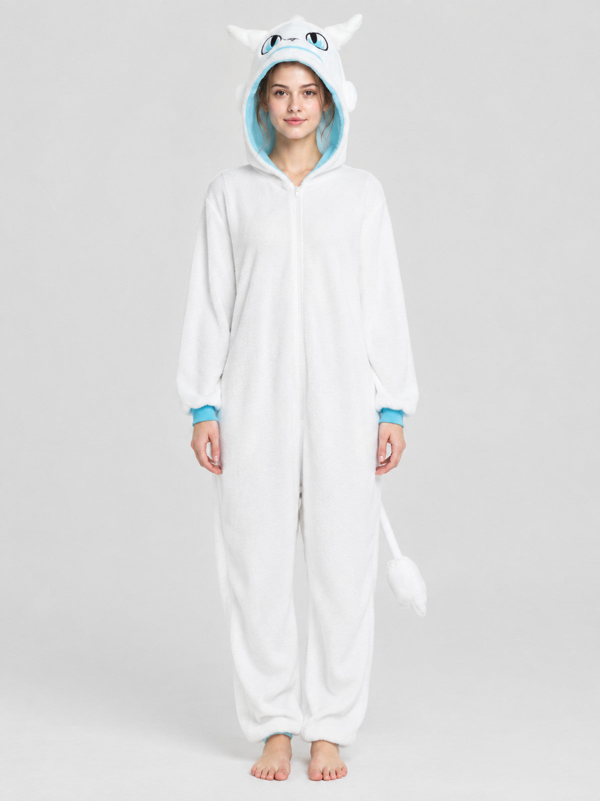 white jumpsuit pajama with blue trim and a tail
