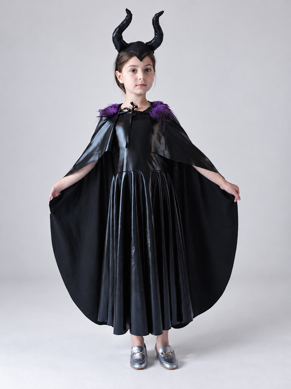 Costume: black dress, cape, headband with horns
