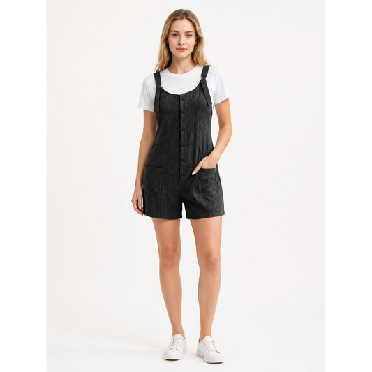Black bib shorts with adjustable straps, front buttons, and two pockets, shown full-body on a model over a white T-shirt