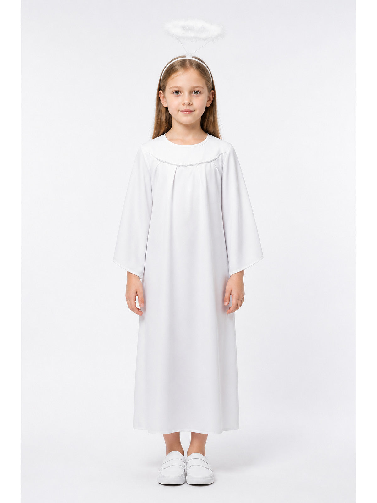 White angel costume dress and halo on a child, shown full-body with long sleeves and white shoes against a plain studio background