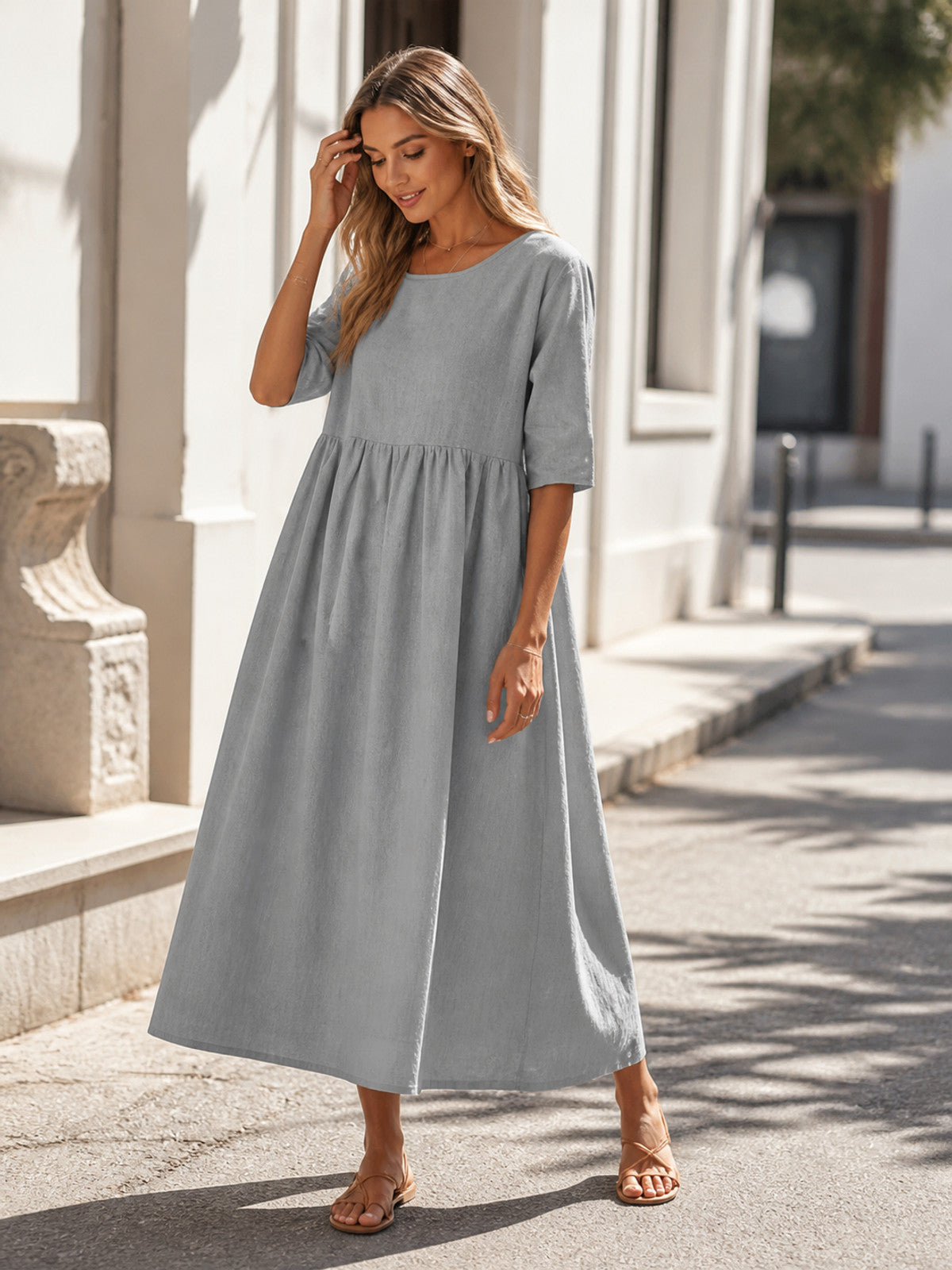 Long Gray Dress with 3/4 Sleeves and an A-Line Silhouette