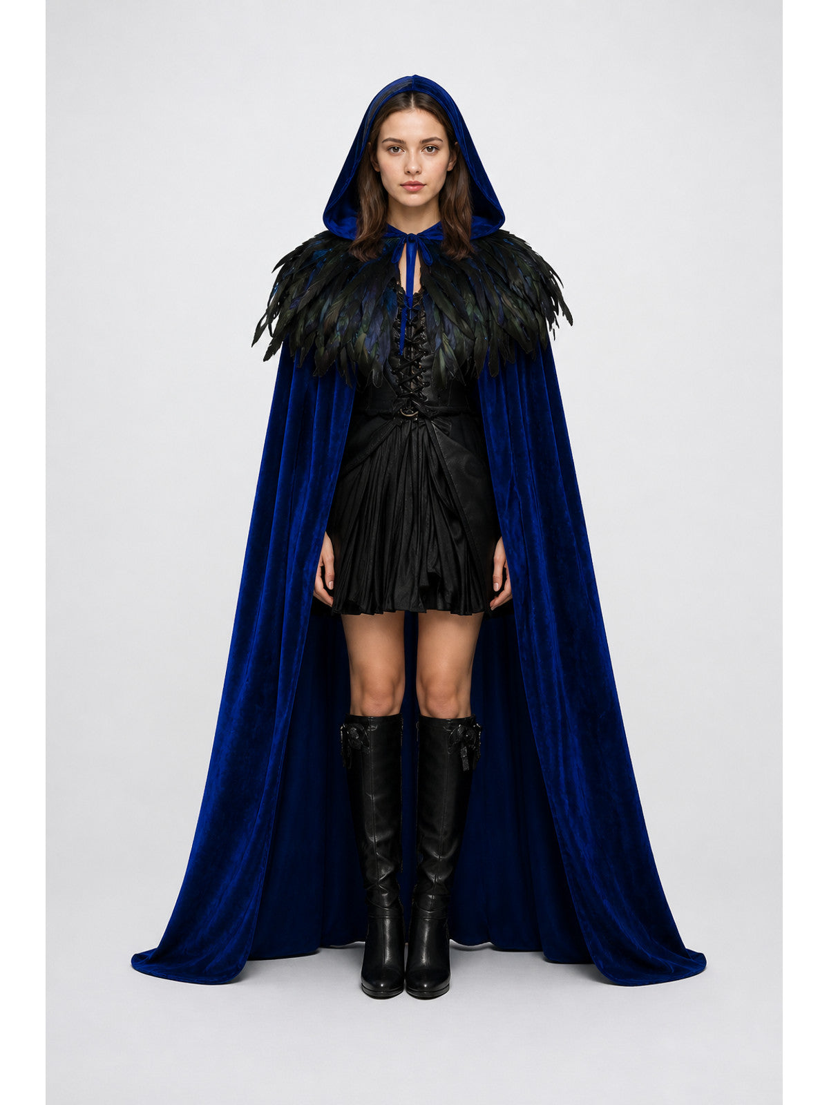 Blue hooded cape with a velvet-like finish and black feather trim, shown full-body on a model with front ties
