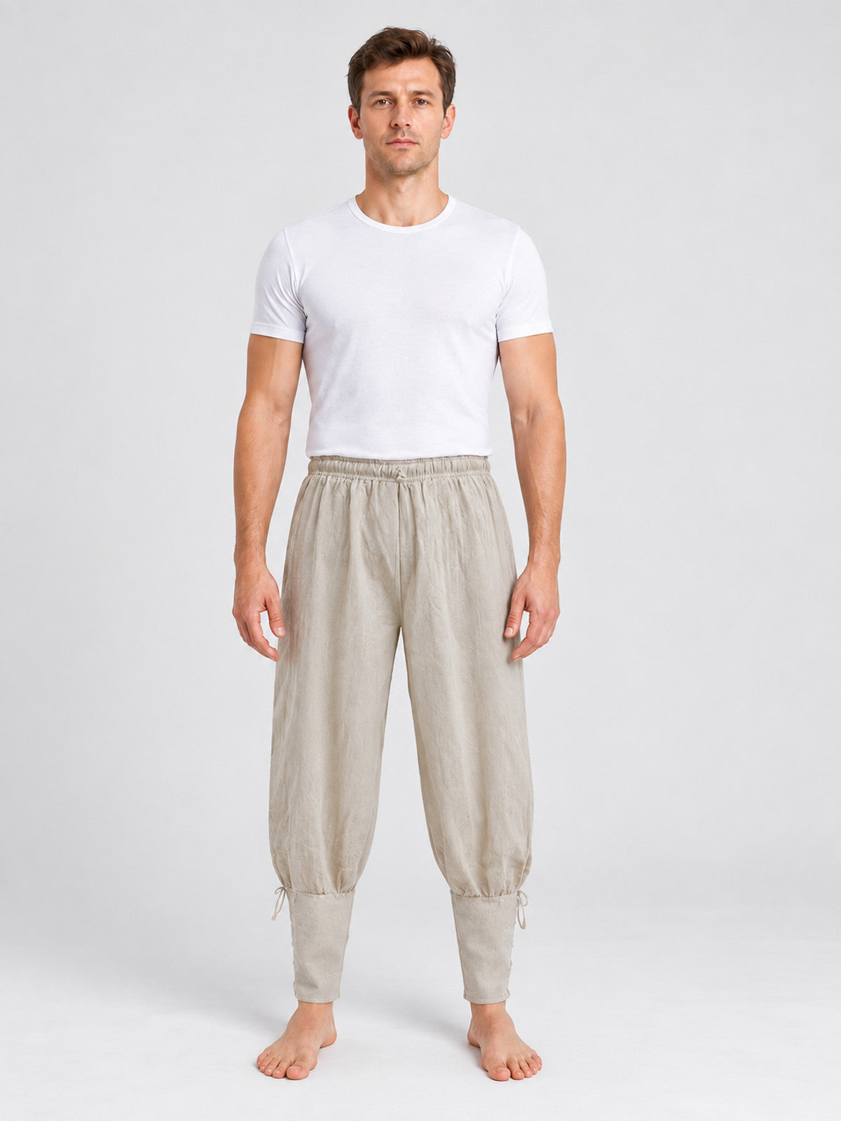 Beige long loose pants with ties at the cuffs