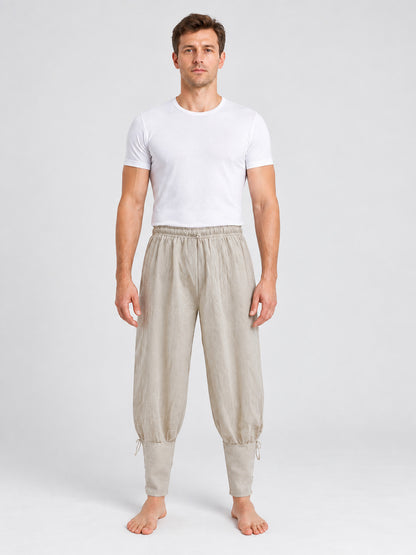 Beige long loose pants with ties at the cuffs