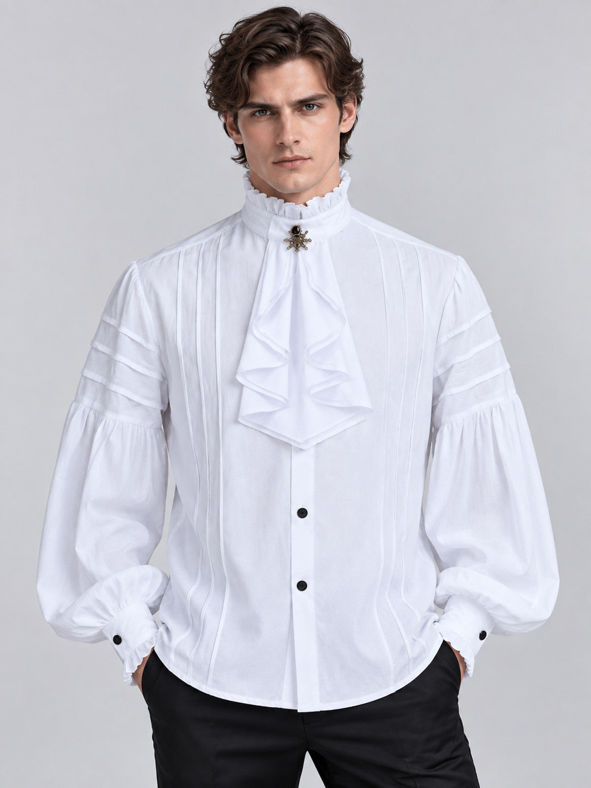 White shirt with a high collar, ruffles, and a brooch