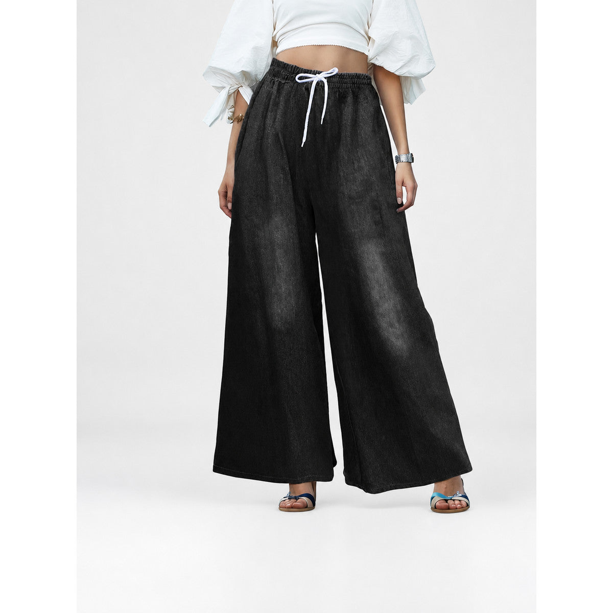 Black wide-leg pants with an elastic waistband and drawstring