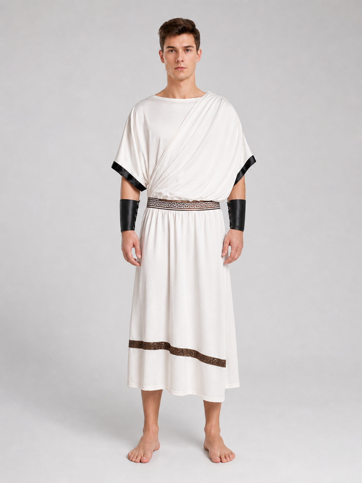 White draped tunic shown full-body on a model, with black sleeve edging, patterned waist belt, brown hem trim, and black wrist cuffs